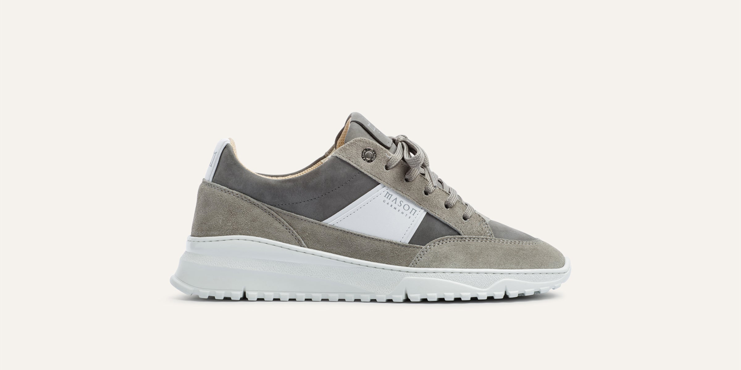 Gray and white sneaker on a light gray background