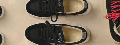 Zoom out of flatlay with black sneakers | Mason Garments